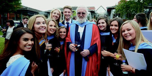Billy Connolly with graduates