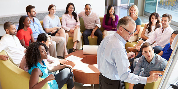 Businessman giving presentation to employees