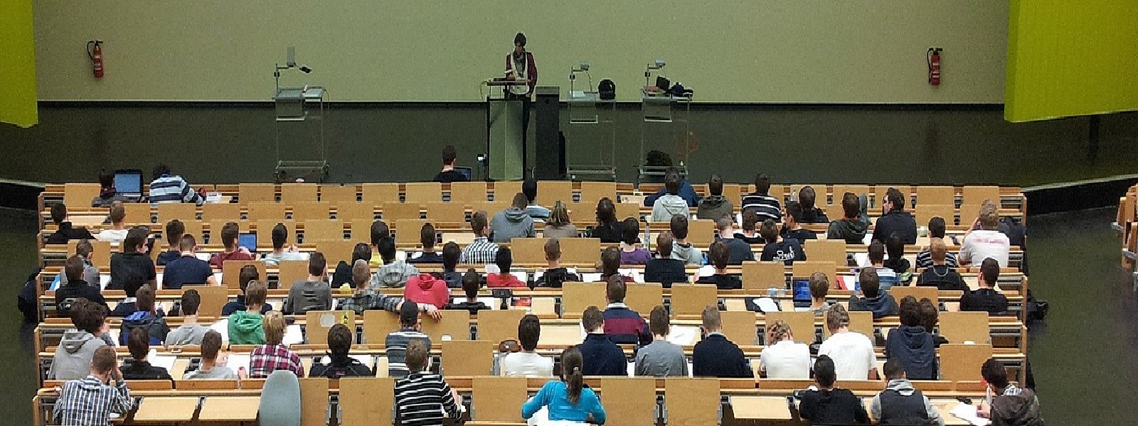 An academic teaching students in a lecture theatre