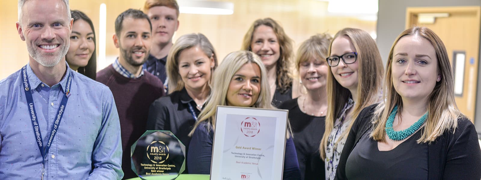 The Team with their M&IT award