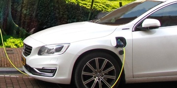 An electric car plugged in to charge