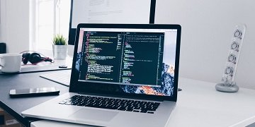 An open laptop with data on the screen