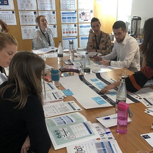 A group of people working together round a table