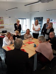 Group of people working together around a table