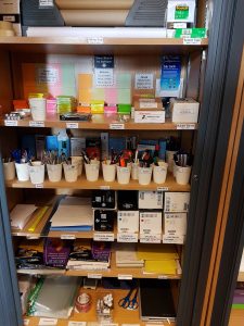 An organised stationery cupboard