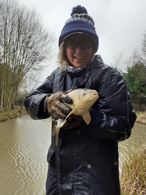Susan Hillis holding a carp