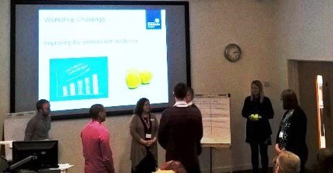 Group of people doing an exercise with tennis balls Group of people doing an exercise with tennis balls