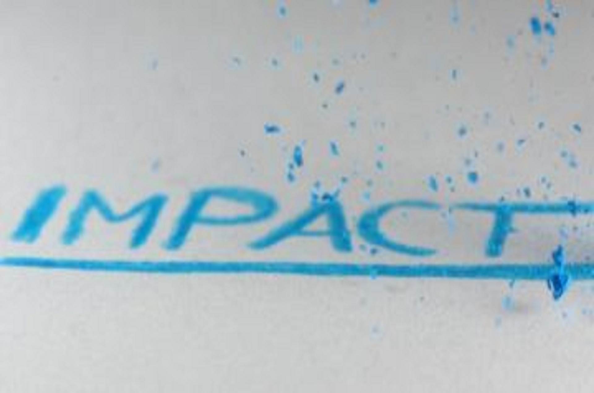 the word 'impact' written in blue pencil