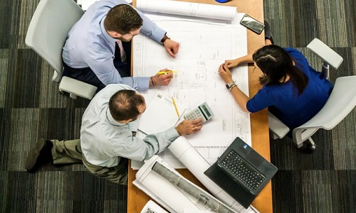 Arial view of people meeting round a table