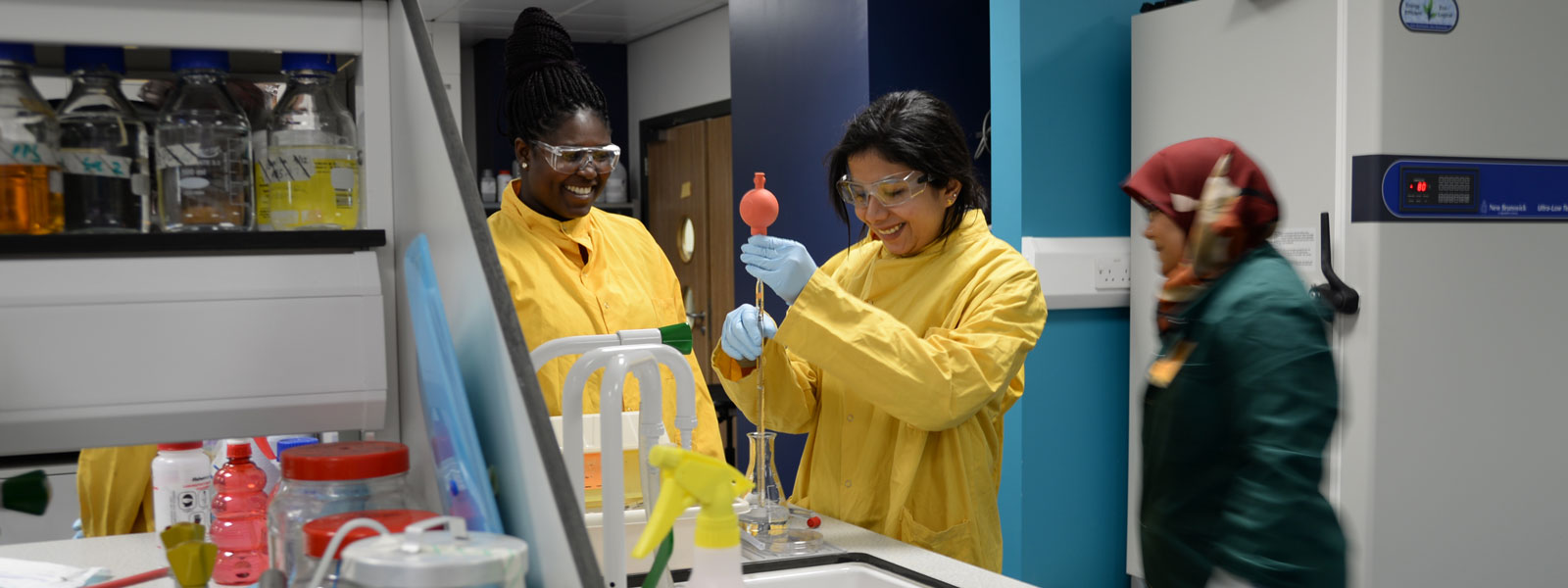 two female students carrying out an experiment