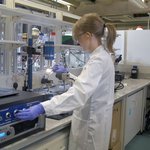 Scientists working in a CMAC lab