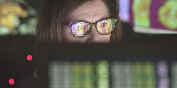 Woman with glasses using a computer