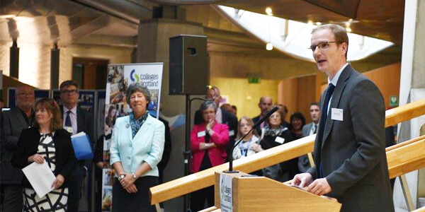 Graeme Roy speaking at the Scottish Parliament