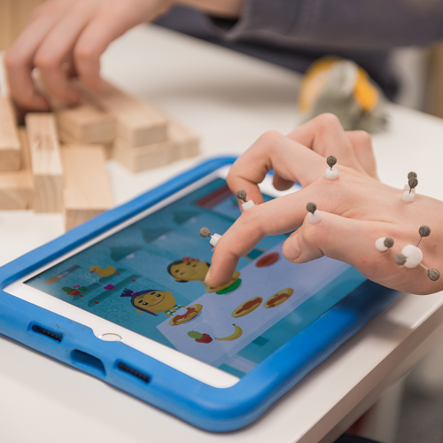 hand w/ motion sensors on an ipad