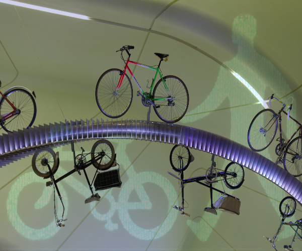 bicycles suspended on a blue arch