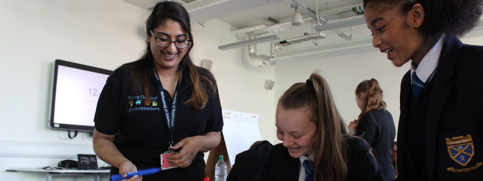 female pupils taking part in outreach event