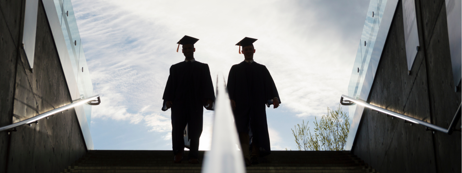 two students at top of stairs