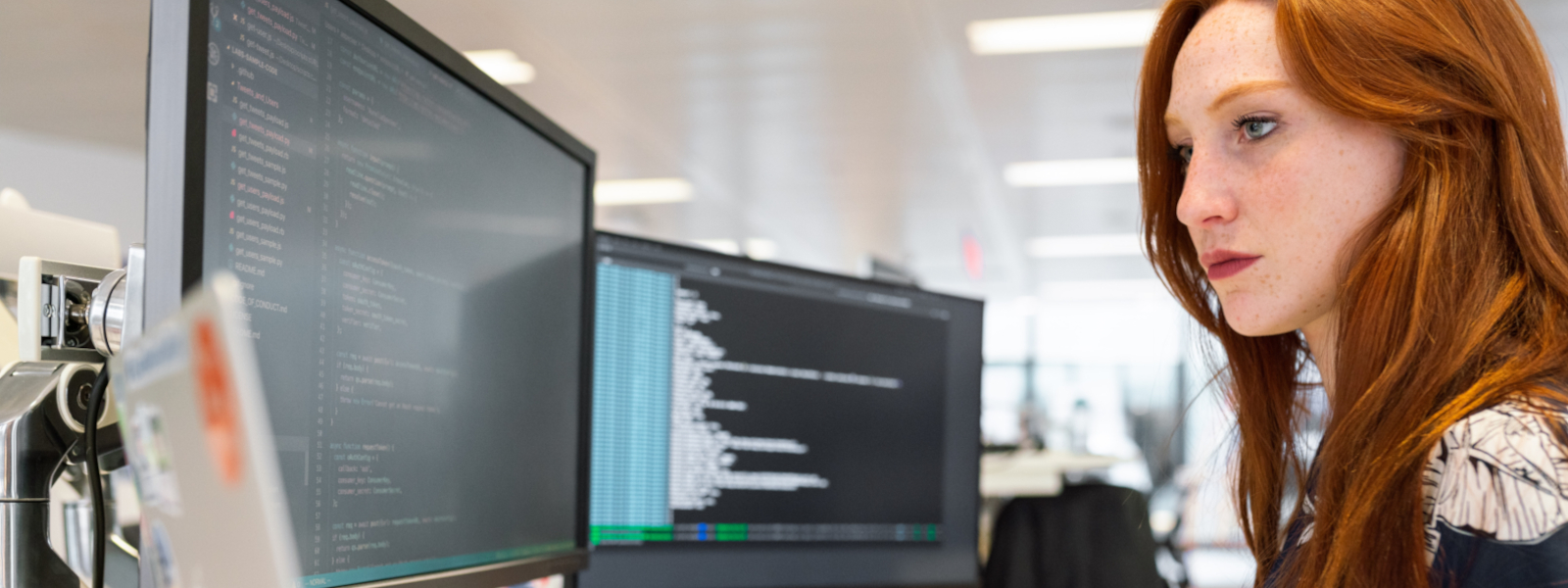 Woman infront of monitors