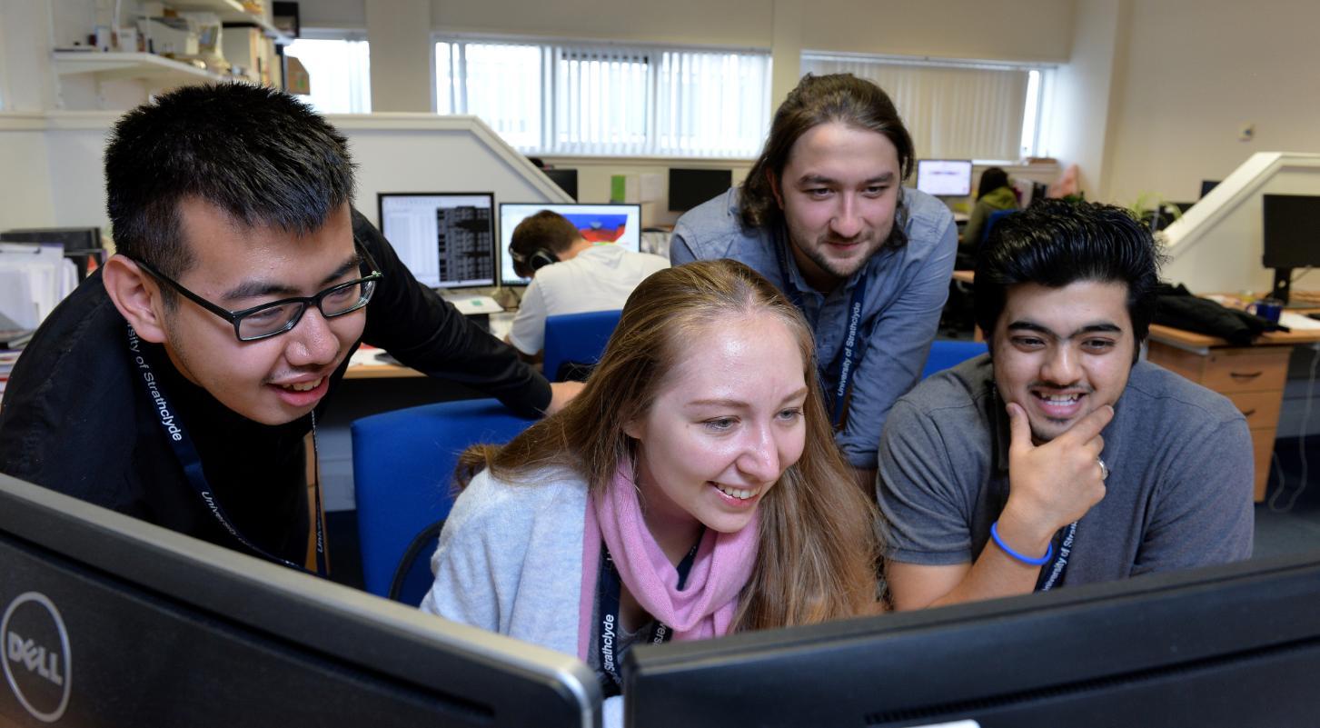 Students looking at monitors