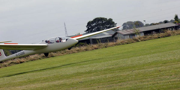 gemma houston in a glider as it takes off from an airfield