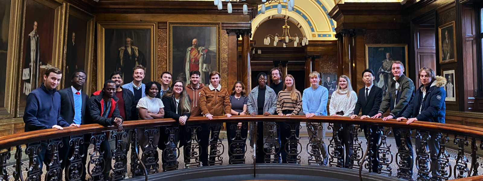 A group of students pose in a photo at Glasgow CIty Chambers