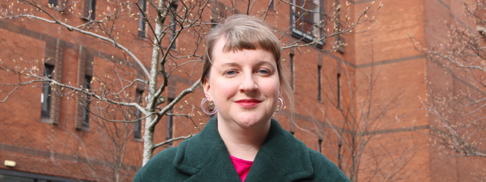 Prof Laura Kelly of Strathclyde's History department standing in front of Strathclyde's Lord Hope building