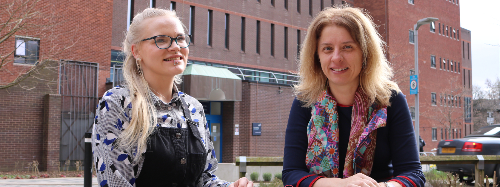 Dr Emmaleena Kakela and Prof Daniela Sime sitting on the Strathclyde campus