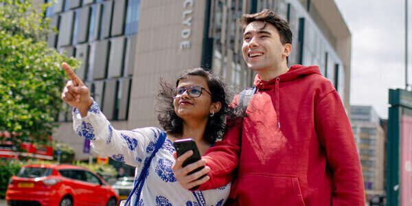 Two students sightseeing outside Technology & Innovation Centre