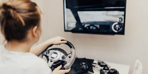 Girl using a driving simulator