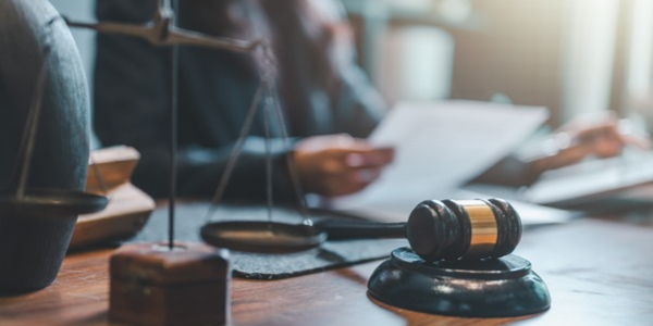 Stock photo of lawyer reading court documents in an office
