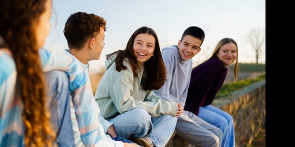 Photo of a group of adolescents smiling