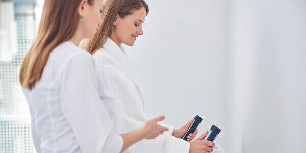 Two woman working in a clinical setting