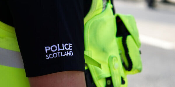Police officer on duty on a city centre street during special event