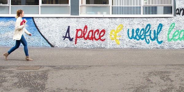 'A place of useful learning' graffiti on the wall