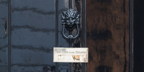 Close up of black 10 Downing St door with gold letterbox