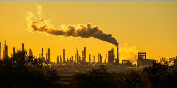 Smoke stacks emmitting carbon pollution into the sky causing climate change