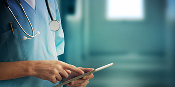 Nurse using a tablet