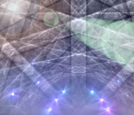 Artistic view of a pattern produced in a silicon crystal from incident and backscattered electrons Artistic view of a pattern produced in a silicon crystal from incident and backscattered electrons