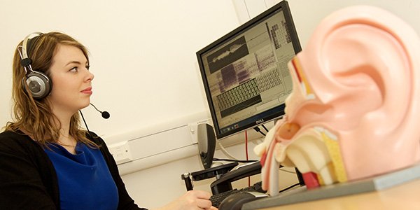 Female student working on speech and language facilities 