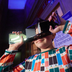 Boy looking through magic glasses