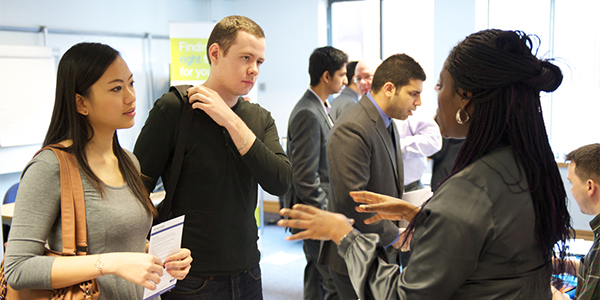 Postgraduate students at a career fair