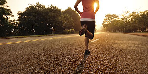 a woman running on the road