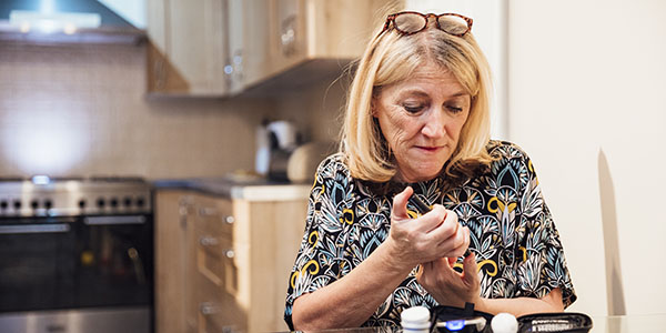 Woman administering insulin