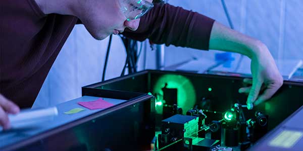 Scientist work with a laser machine 