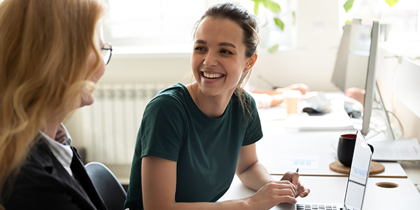 Woman speaking to a colleague 