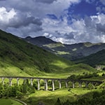 Summer sunlight illuminating the iconic arches of the Gelnfinnan Viaduct