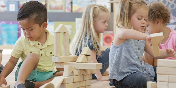 Children playing in nursery 600x300