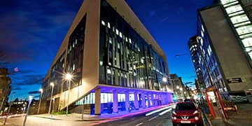 Artistic shot of the Technology & Innovation Centre lit up at night