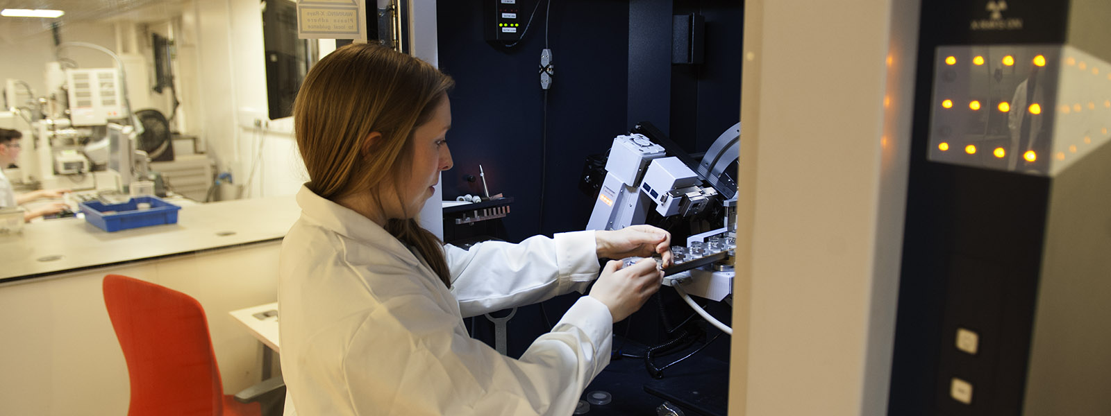 Researcher carries out diffraction analysis.