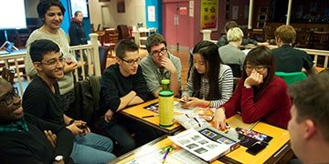 Students studying round a table